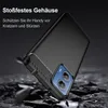 A black phone case is shown in a dynamic, falling pose against a dark, rocky background, with text overlay describing its features. Produktbild-Vorschau