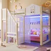 A child's bedroom featuring a white and natural wood loft bed with a castle design, complete with LED lighting, curtains, and a pink sofa underneath. Voir les images du produit