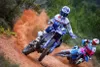 Two motocross riders racing on a dirt track, kicking up dust. Náhľad obrázku produktu