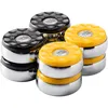 A set of shuffleboard pucks, with black and yellow tops, arranged in a group. Voir les images du produit