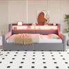 A modern bedroom or living room setting featuring a gray upholstered daybed with a built-in shelf and LED lighting. Voir les images du produit