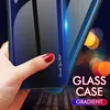 A hand holding a phone case with a gradient blue and black design, with bokeh lights in the background. Produktbild-Vorschau