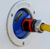 A close-up view of a water inlet connector on a white surface, with a yellow hose attached. Voir les images du produit