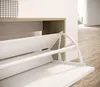 A close-up view of an open shoe cabinet with white shelves and a wood-grain frame. Produktbild-Vorschau