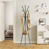 A coat rack with a hat, scarf, and coat is shown in a room with a bed and shelves. Produktbild-Vorschau