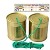 Two tin cans connected by a green string, with an instructional diagram above showing how a can phone works. Produktbild-Vorschau