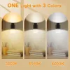 Three arched panels showing the same lamp in different color temperatures. Produktbild-Vorschau