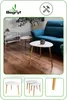 A living room scene with a blue sofa and two white coffee tables with wooden legs. Produktbild-Vorschau
