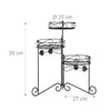A three-tiered metal plant stand with decorative scrollwork and leaf accents, shown with dimensions indicated. Náhľad obrázku produktu
