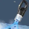A black and transparent handheld vacuum cleaner is shown in action, with blue light effects indicating suction and dust being drawn in. Náhled obrázku produktu