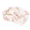 A miniature sofa with a floral pattern. Náhled obrázku produktu