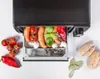 Food items and sausages are arranged in and around a cooking appliance. Voir les images du produit