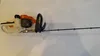 A hedge trimmer is shown on a white background. Produktbild-Vorschau