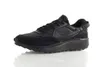 A black Nike Waffle Debut sneaker is shown from the side against a white background. Náhled obrázku produktu