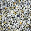 A close-up, overhead view of a pile of small, multi-colored pebbles. Produktbild-Vorschau
