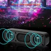 A black speaker with blue sound wave graphics overlaid, set against a blurred background of a concert crowd and stage lights. Produktbild-Vorschau