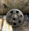 A close-up of a metal clutch drum, likely for a chainsaw, resting on a surface with some packaging visible. Produktbild-Vorschau