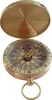 A brass compass with its lid open, showing the compass face. Produktbild-Vorschau