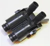 A black plastic adapter with two hose barbs on top and two threaded connectors on the bottom, set against a white background. Náhled obrázku produktu