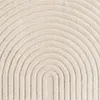 A close-up view of a textured rug with a repeating arched pattern. Voir les images du produit