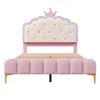 A pink upholstered bed frame with a crown-shaped headboard. Podgląd zdjęcia produktu