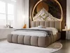 A modern bedroom with a large upholstered bed as the focal point, featuring a unique mountain-themed headboard. Produktbild-Vorschau