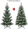 Two artificial Christmas trees are shown side-by-side, with an arrow indicating a transformation from a more compact state to a fuller, more spread-out state. Náhľad obrázku produktu