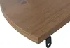 A close-up view of the corner of a wooden shelf with a black bracket attached. Anteprima dell’immagine prodotto