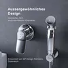 A close-up of a modern bidet faucet and hand sprayer set mounted on a textured gray wall. Produktbild-Vorschau