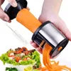 A person is using a vegetable spiralizer to cut a carrot into thin strips, with a salad in the background. Produktbild-Vorschau