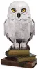 A 3D model of Hedwig the owl from Harry Potter, standing on a stack of books. Produktbild-Vorschau