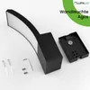 A black outdoor wall light and its mounting hardware are displayed on a white background. Anteprima dell’immagine prodotto