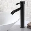 A black faucet is shown in a bathroom setting, positioned over a white sink. The background features a white brick-patterned wall. Anteprima dell’immagine prodotto