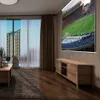 A living room with a projector screen displaying a soccer game, a wooden TV stand, and a coffee table. Produktbild-Vorschau