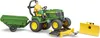 A toy tractor with a trailer and attachments, driven by a toy figure. Produktbild-Vorschau