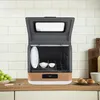 A countertop dishwasher is shown open with dishes inside, placed on a kitchen counter. Produktbild-Vorschau