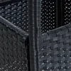 A close-up view of the woven texture of a black polyrattan table. Produktbild-Vorschau