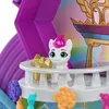 A close-up view of a toy pony figure on a balcony with decorative elements. Produktbild-Vorschau