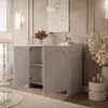 A modern living room with a light gray two-door cabinet, a floor lamp, and decorative items. Produktbild-Vorschau