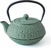 A green cast iron teapot with a black handle is shown against a white background. Podgląd zdjęcia produktu