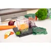 Kitchen counter with vegetables and food storage containers. Produktbild-Vorschau