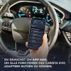 A hand holding a smartphone displaying a car diagnostic app inside a car. Anteprima dell’immagine prodotto