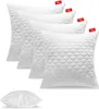 A set of white pillows arranged in a staggered formation, with one pillow placed separately in the foreground. Produktbild-Vorschau