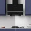 A modern kitchen scene featuring a black range hood, cabinets, and countertop with a frying pan. Anteprima dell’immagine prodotto