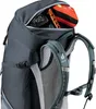 Close-up view of the top opening of a backpack, showing some contents. Podgląd zdjęcia produktu