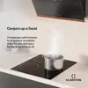 A black induction cooktop with three heating zones, a pot steaming on one zone, and a kitchen hood above. Podgląd zdjęcia produktu