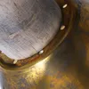 A close-up view of the connection between a wooden handle and a brass fixture on a lamp. Produktbild-Vorschau