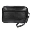 A black leather wrist bag with a strap is shown against a white background. Náhled obrázku produktu
