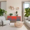 A living room scene with a sideboard, armchair, and sofa. Anteprima dell’immagine prodotto