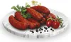 A platter of sausages with cherry tomatoes and parsley. Produktbild-Vorschau